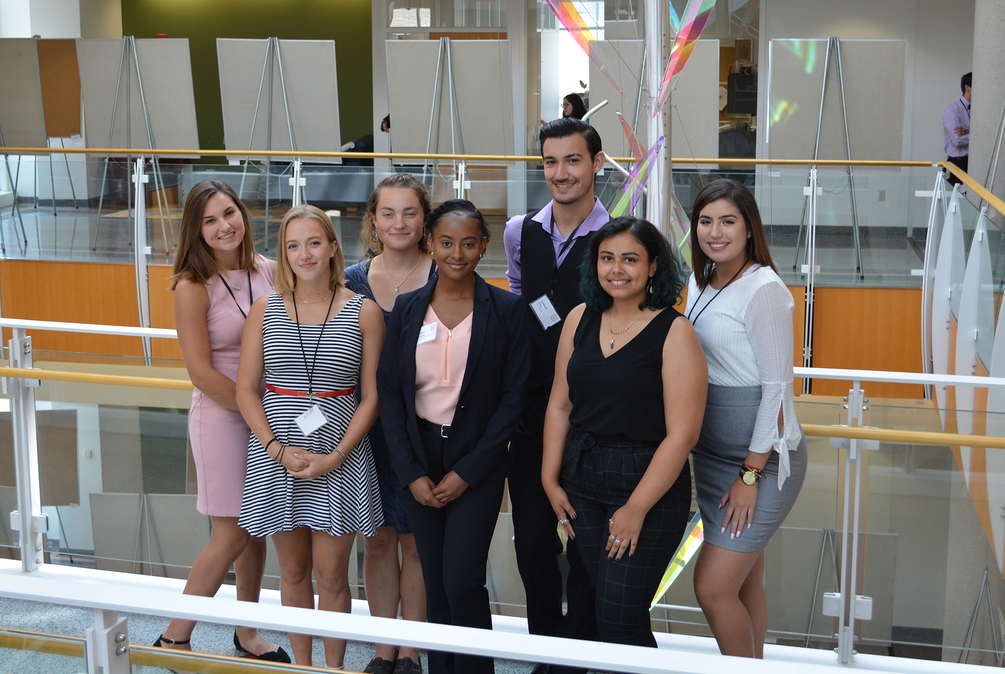 Callie Vitro, Elsa Rodriguez, Madeline Conway, Carington McGowan, Anthony Cruz, Kayla Osman, and Maria Zapata take a break during the Summer MU Undergraduate Research and Creative Achievements Forum at the Bond Life Sciences Center. As part of the MU-ARTSS program, each student created a poster to present at the forum.